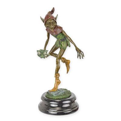 A BRONZE SCULPTURE OF A GOBLIN WITH SNAILS ON A LEAF