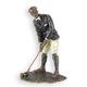 A BRONZE SCULPTURE OF A GOLFER