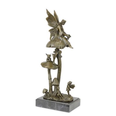 A BRONZE SCULPTURE OF A GROUP OF FAIRIES RESTING ON MUSHROOM