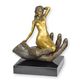 A BRONZE SCULPTURE OF A HAND HOLDING A WOMAN