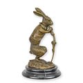 A BRONZE SCULPTURE OF A HARE DRESSED AS A HUNTER