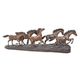 A BRONZE SCULPTURE OF A HERD OF RUNNING HORSES
