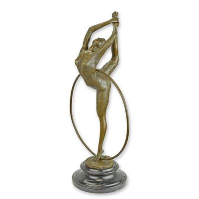 A BRONZE SCULPTURE OF A HOOP DANCER