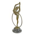 A BRONZE SCULPTURE OF A HOOP DANCER