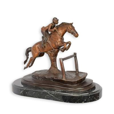 A BRONZE SCULPTURE OF A HORSE AND RIDER