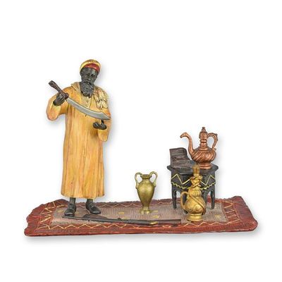 A BRONZE SCULPTURE OF A HUNTER WITH SWORD
