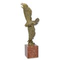 A BRONZE SCULPTURE OF A HUNTING EAGLE