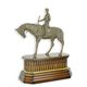 A BRONZE SCULPTURE OF A JOCKEY ON HORSE ON WOODEN BASE