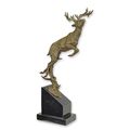 A BRONZE SCULPTURE OF A JUMPING DEER