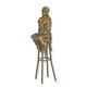 A BRONZE SCULPTURE OF A LADY ON BARCHAIR