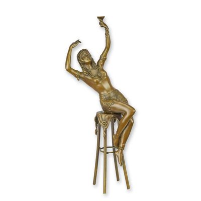 A BRONZE SCULPTURE OF A LADY ON BARCHAIR