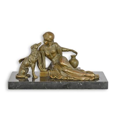 A BRONZE SCULPTURE OF A LADY WITH BORZOI