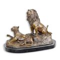 A BRONZE SCULPTURE OF A LION AND LIONESS