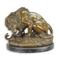 A BRONZE SCULPTURE OF A LION AND SERPENT