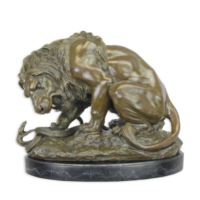 A BRONZE SCULPTURE OF A LION AND SERPENT
