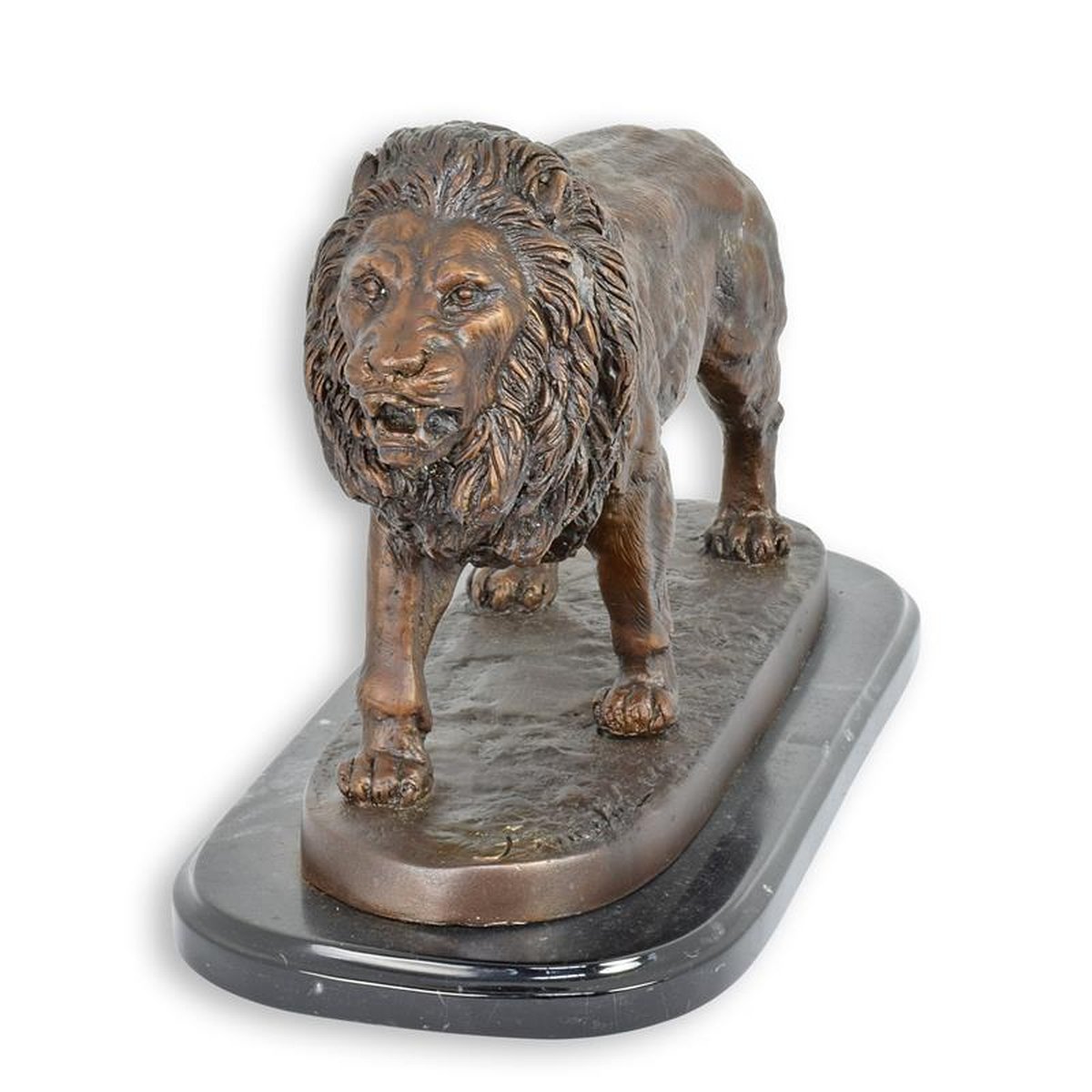 A BRONZE SCULPTURE OF A LION