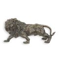 A BRONZE SCULPTURE OF A LION