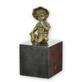 A BRONZE SCULPTURE OF A LITTLE GIRL SITTING