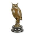 A BRONZE SCULPTURE OF A LONG-EARED OWL