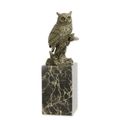 A BRONZE SCULPTURE OF A LONG-EARED OWL