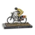 A BRONZE SCULPTURE OF A MAN ON A BIKE