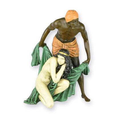 A BRONZE SCULPTURE OF A MAN SHIELDING A WOMAN
