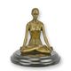 A BRONZE SCULPTURE OF A MEDITATING WOMAN