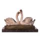 A BRONZE SCULPTURE OF A PAIR OF SWANS