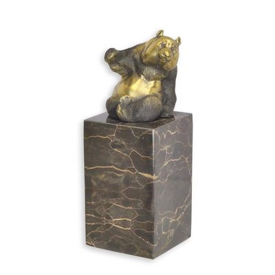 A BRONZE SCULPTURE OF A PANDA