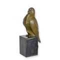 A BRONZE SCULPTURE OF A PIGEON