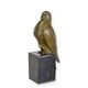 A BRONZE SCULPTURE OF A PIGEON