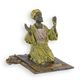 A BRONZE SCULPTURE OF A PRAYER ON RUG
