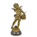A BRONZE SCULPTURE OF A PUTTO PLAYING DRUMS