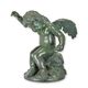 A BRONZE SCULPTURE OF A PUTTO