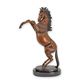 A BRONZE SCULPTURE OF A REARING HORSE