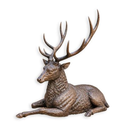 A BRONZE SCULPTURE OF A RECLINING DEER
