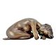 A BRONZE SCULPTURE OF A RECLINING FEMALE NUDE