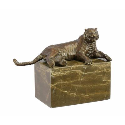 A BRONZE SCULPTURE OF A RECLINING TIGER