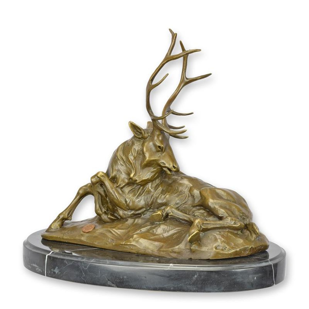 A BRONZE SCULPTURE OF A RECUMBENT STAG