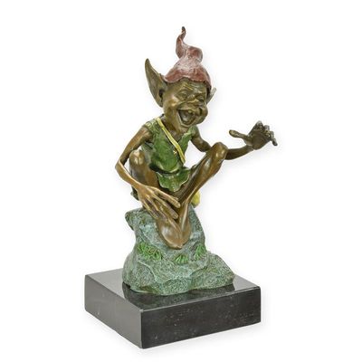 A BRONZE SCULPTURE OF A RESTING GOBLIN