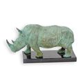 A BRONZE SCULPTURE OF A RHINOCEROS - OLD GREEN