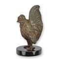 A BRONZE SCULPTURE OF A ROOSTER