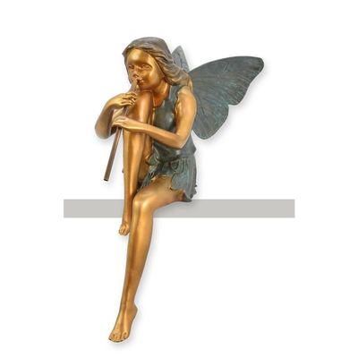 A BRONZE SCULPTURE OF A SEATED FAIRY PLAYING FLUTE