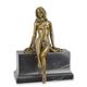 A BRONZE SCULPTURE OF A SEMI NUDE FEMALE