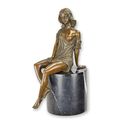 A BRONZE SCULPTURE OF A SEMI NUDE FEMALE