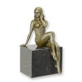 A BRONZE SCULPTURE OF A SEMI NUDE FEMALE