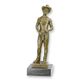 A BRONZE SCULPTURE OF A SEMI NUDE MAN DRESSED AS A COWBOY