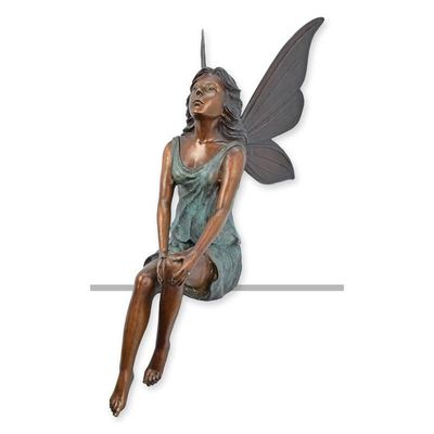 A BRONZE SCULPTURE OF A SITTING ANGEL