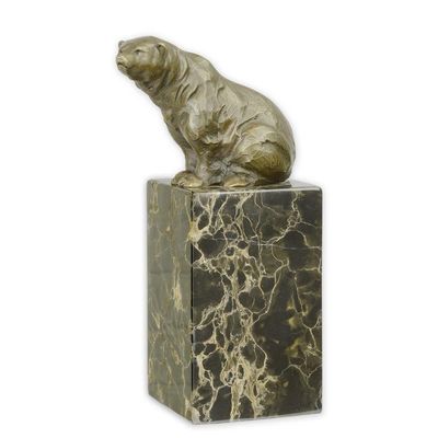 A BRONZE SCULPTURE OF A SITTING BEAR