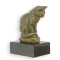 A BRONZE SCULPTURE OF A SITTING CAT